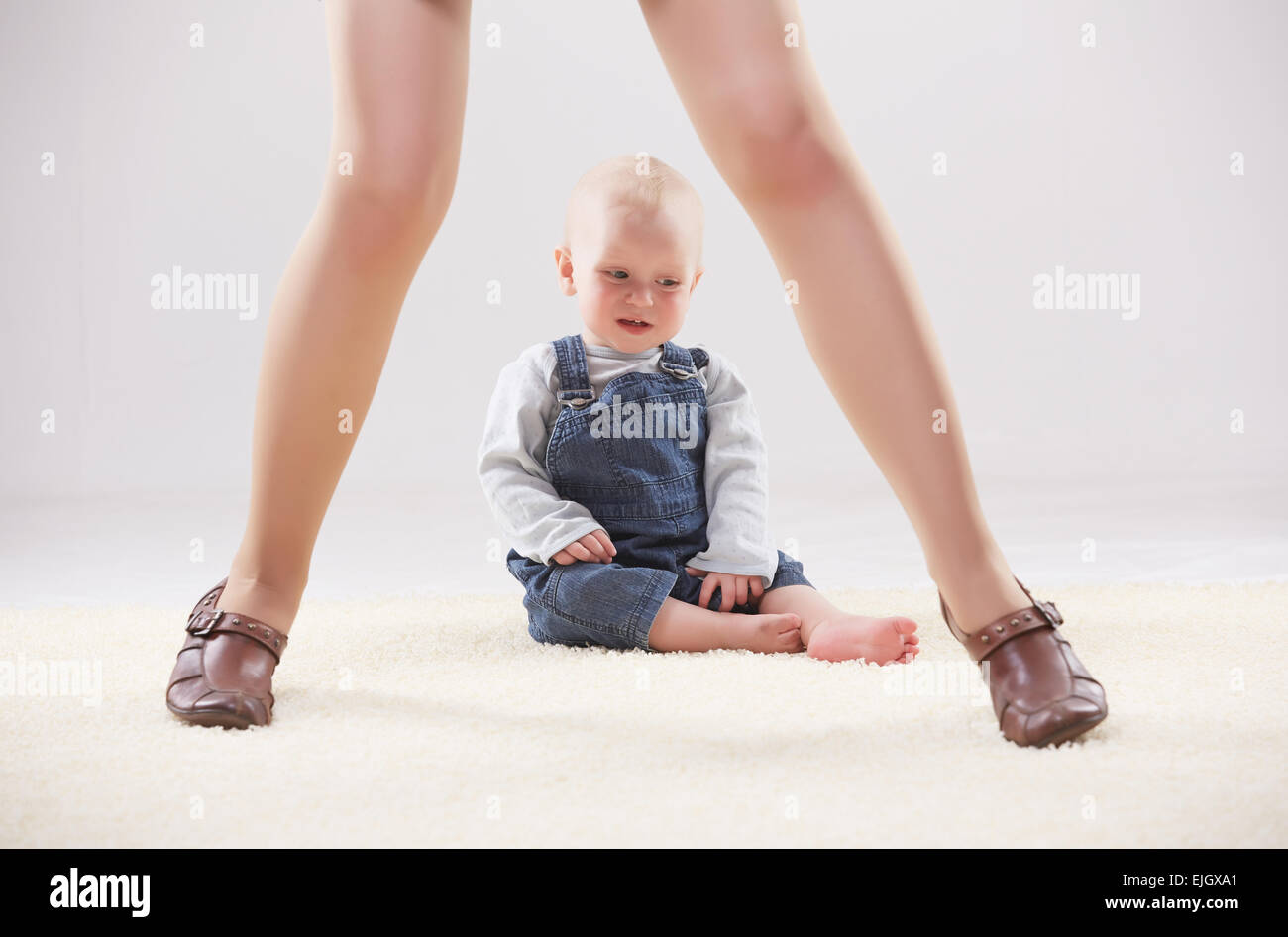 Baby between legs mom hires stock photography and images Alamy