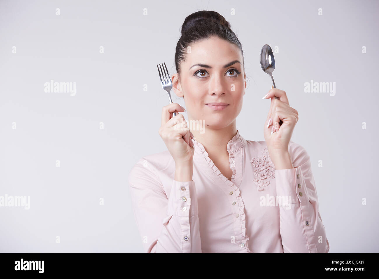 woman with spoon and fork Stock Photo Alamy
