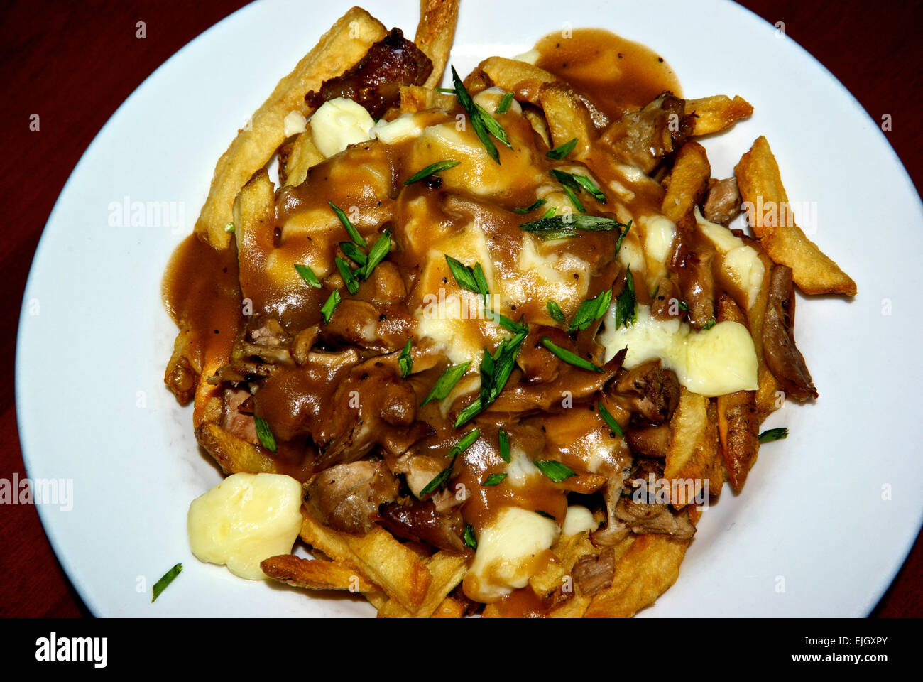 Duck meat gravy cheese curds french fries poutine Stock Photo Alamy