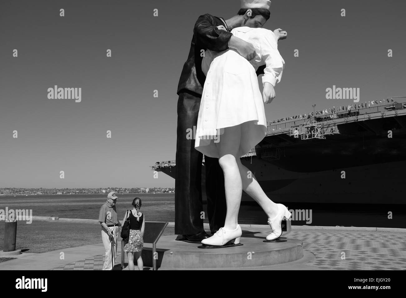 USS Midway on the waterfront in San Diego, and statue of Sailor Kissing