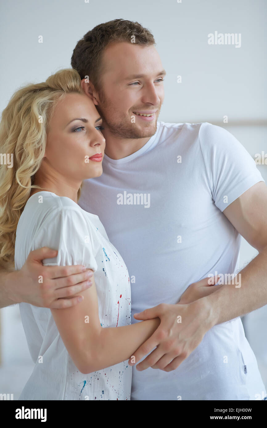 couple standing embracing Stock Photo - Alamy