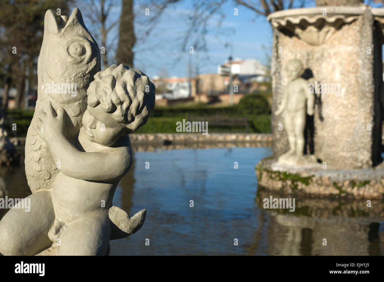 Cherub boys on water fountain statue in garden, Badajoz, Spain Stock Photo