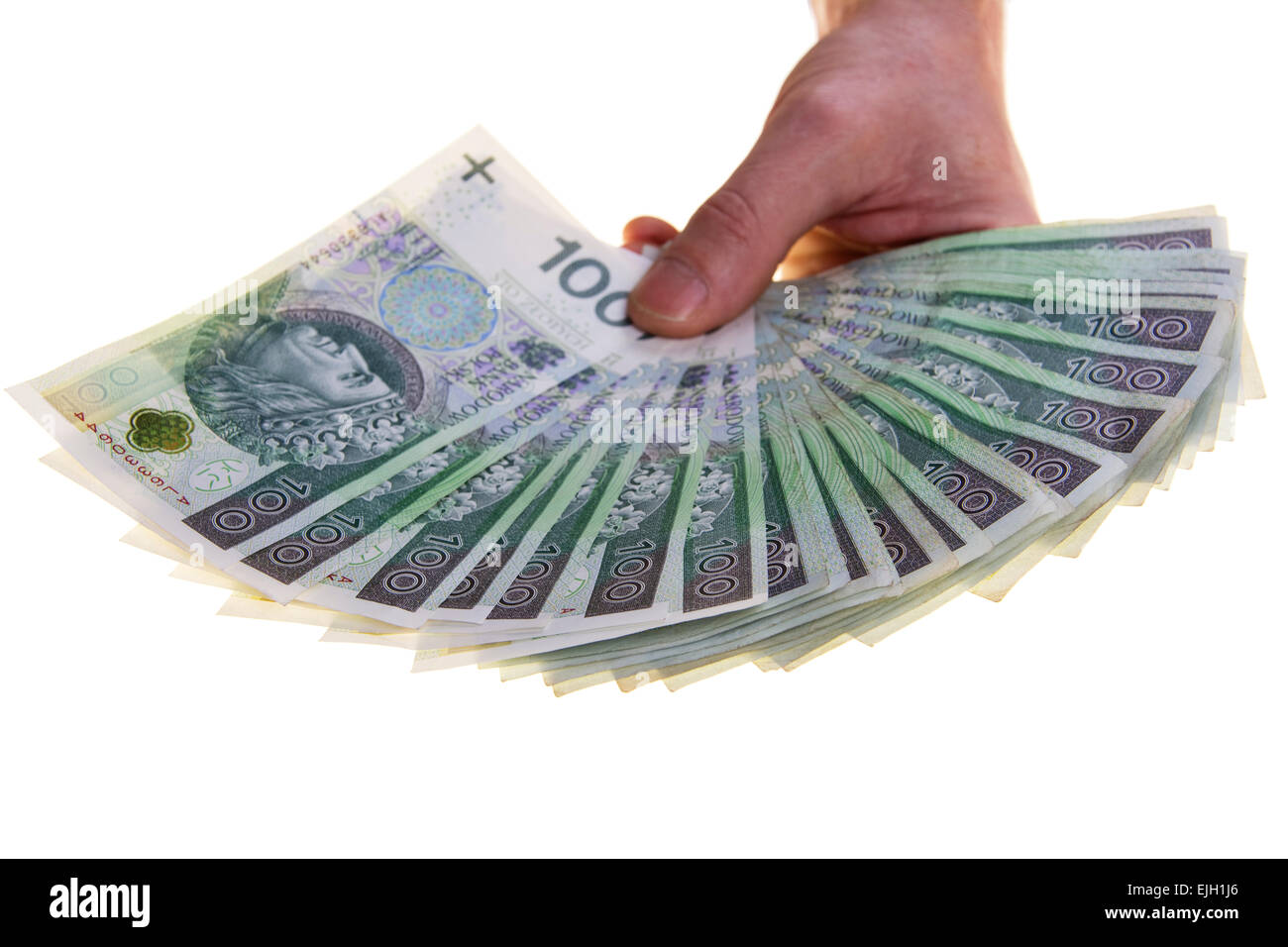 Polish currency banknotes hundred zloty stacked in hand. Stock Photo
