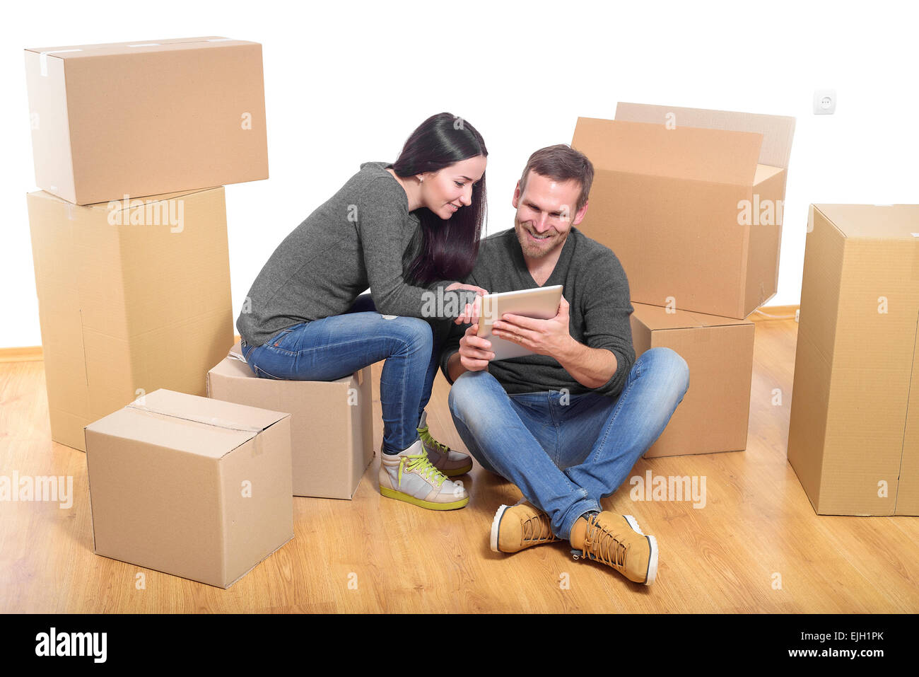 Couple in new home Stock Photo - Alamy