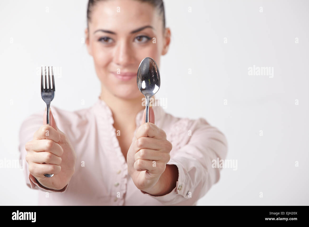 woman with spoon and fork Stock Photo Alamy