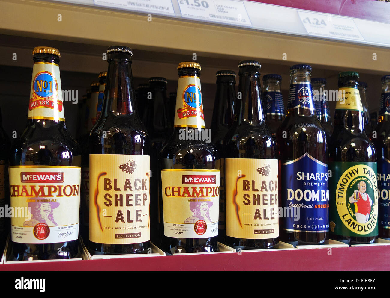 Bottles of Premium Beers on a supermarket shelf in the uk Stock Photo