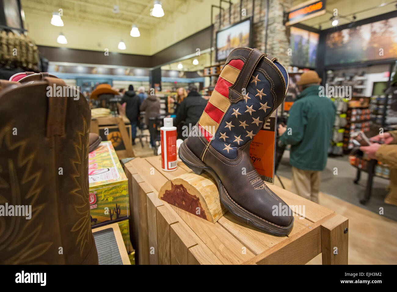 Troy, Michigan - Patriotic boots on sale at the Field & Steam outdoors store. Stock Photo
