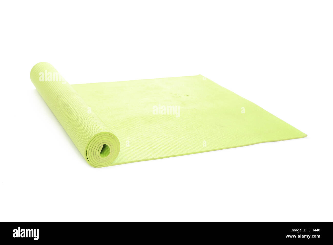 green yoga mat on a white background Stock Photo