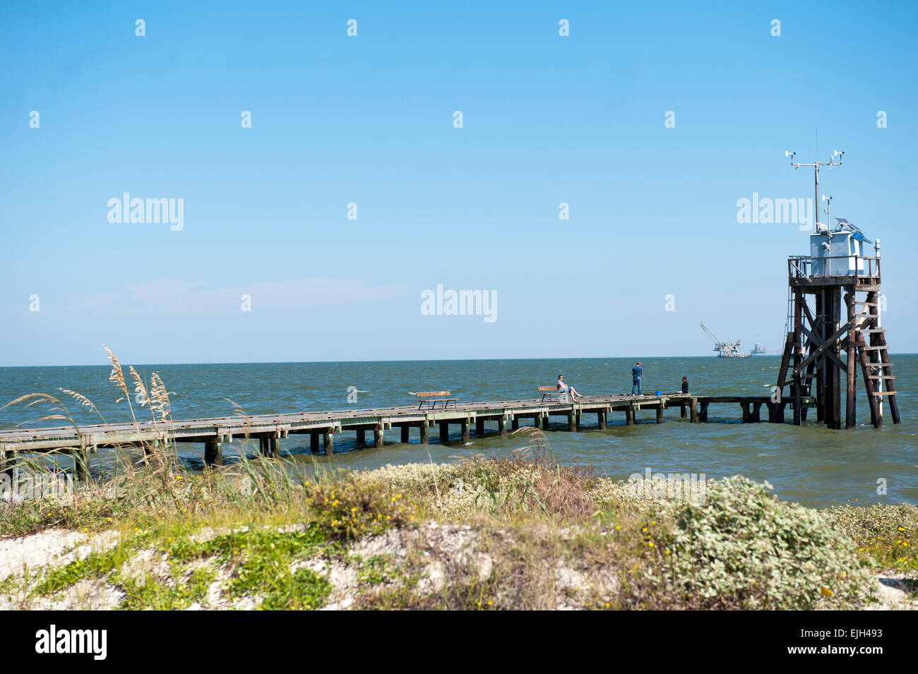 Walking and fishing pier along the shoreline on Dauphin Island Alabama