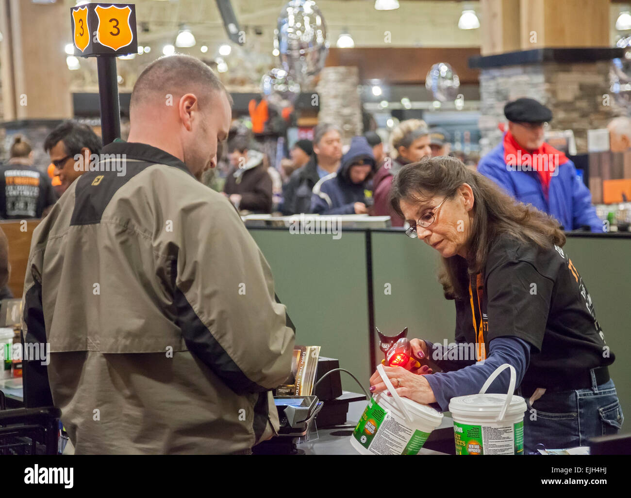 Troy, Michigan - A checkout clerk at the Field & Steam outdoors store. Stock Photo