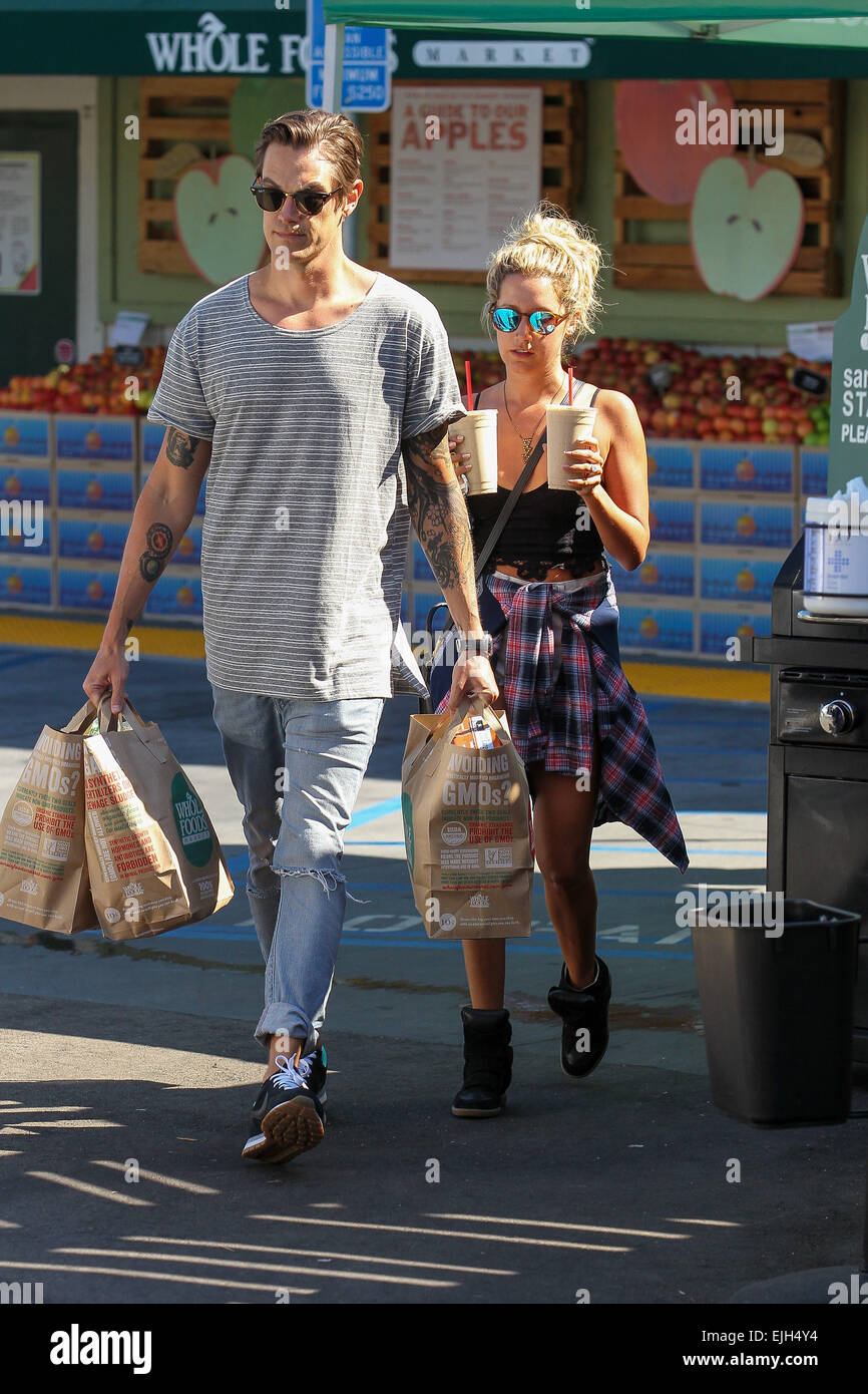 Newly weds Ashley Tisdale and Christopher French laden with groceries and ice coffee as they go shopping at Whole Foods in Studio City Featuring: Ashley Tisdale,Christopher French Where: Los Angeles, California, United States When: 21 Sep 2014 Stock Photo