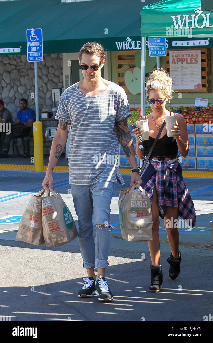 Newly weds Ashley Tisdale and Christopher French laden with groceries and ice coffee as they go shopping at Whole Foods in Studio City Featuring: Ashley Tisdale,Christopher French Where: Los Angeles, California, United States When: 21 Sep 2014 Stock Photo