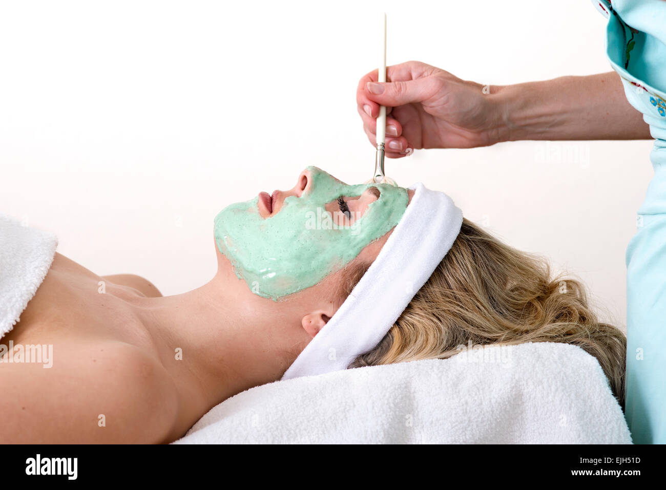 Blond woman mask face lying hi-res stock photography and images - Alamy
