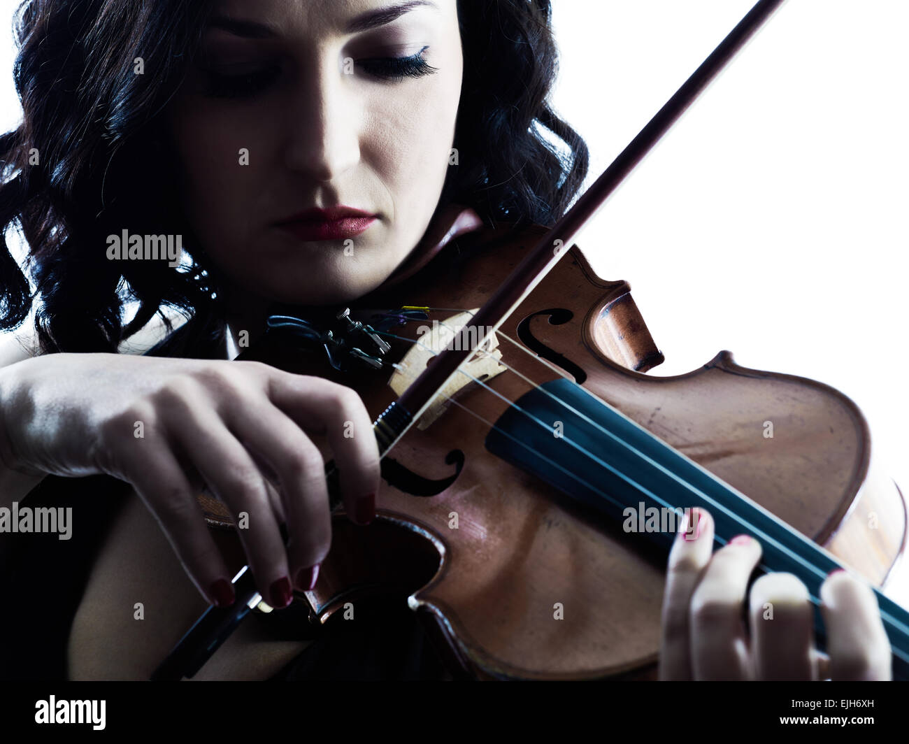 one caucasian Violinist woman player playing violon studio slihouette isolated in white