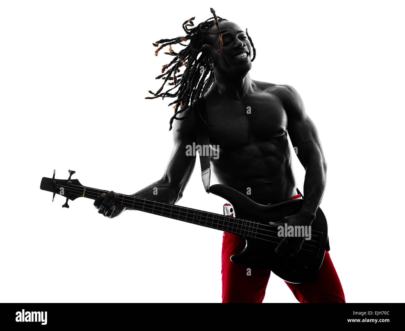 one african man guitarist bassist player playing in studio silhouette isolated on white background Stock Photo