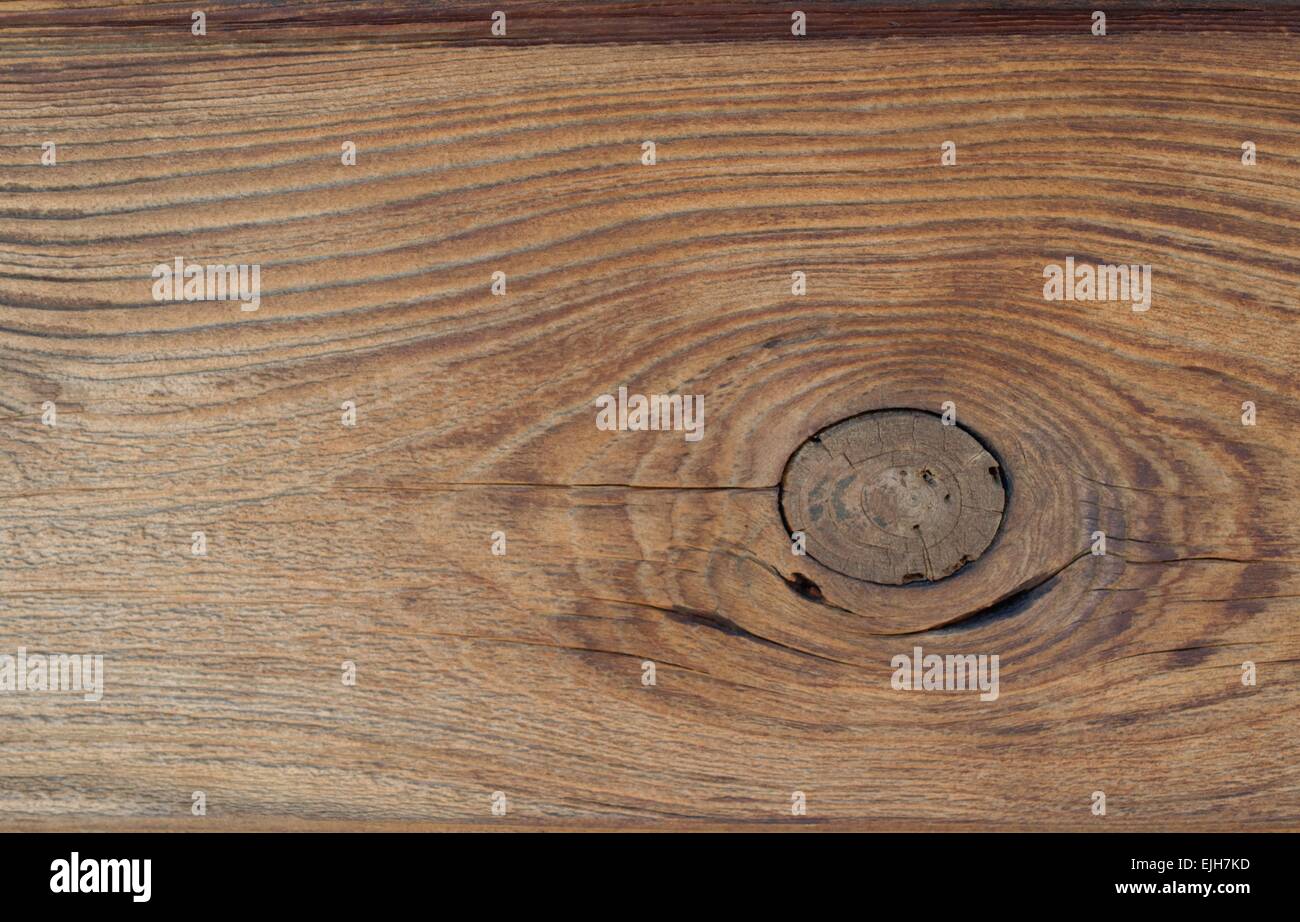 Sun bleached cedar wood siding panel with wood grain and knot Stock Photo