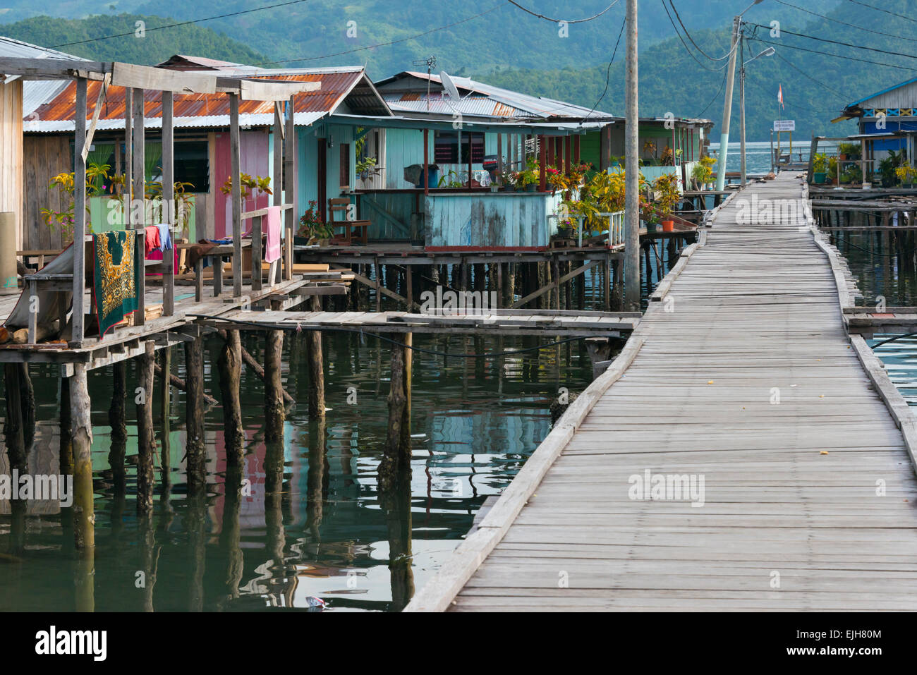 Bridge and stilt houses  of Enggros Village in Yotefa Bay, Jayapura, Papua, Indonesia Stock Photo