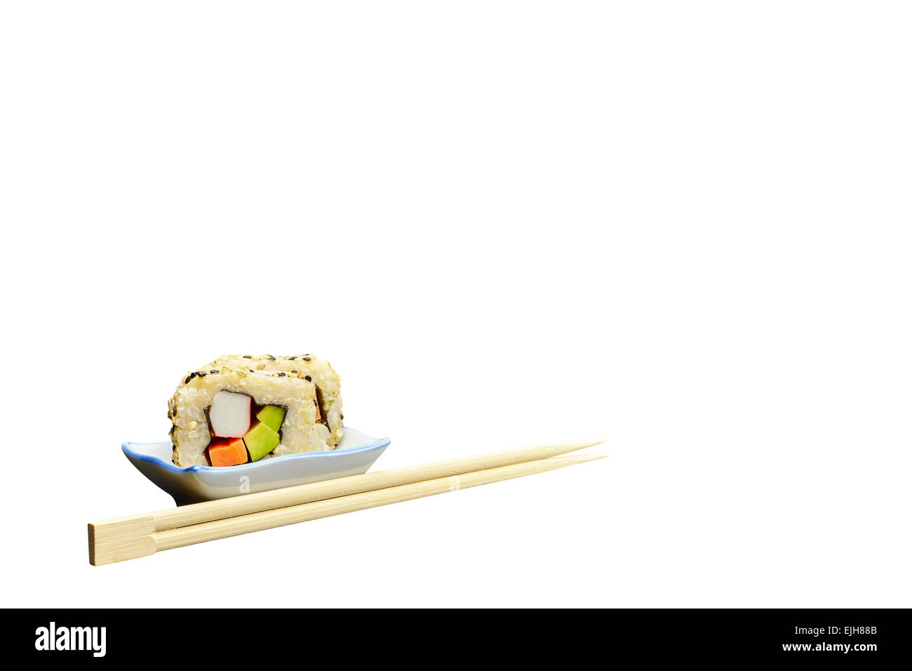 Natural Organic Brown Rice Avocado Japanese vegetarian Sushi with chopsticks isolated on white background Stock Photo