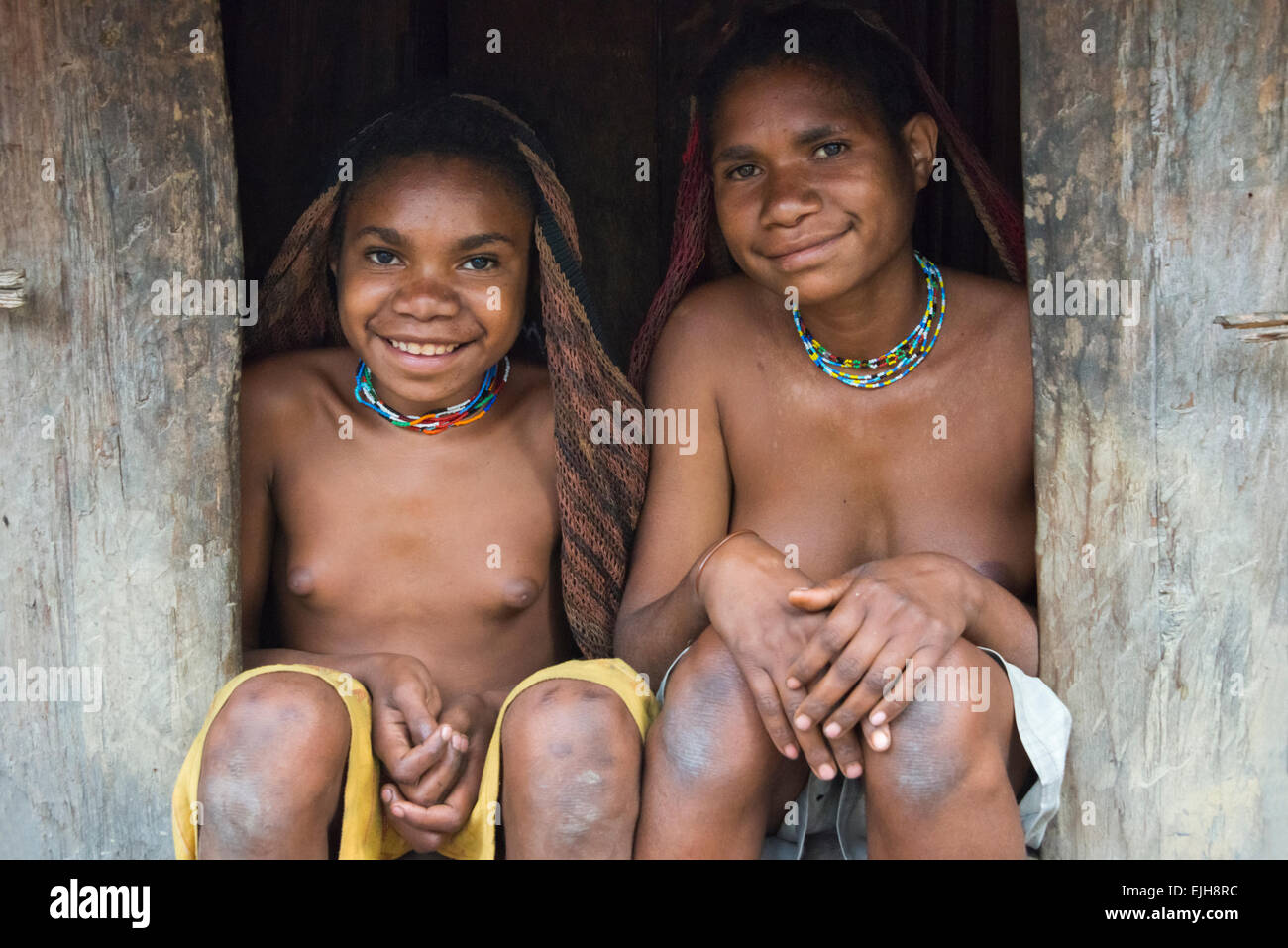 Dani girls in the village, Wamena, Papua, Indonesia Stock Photo