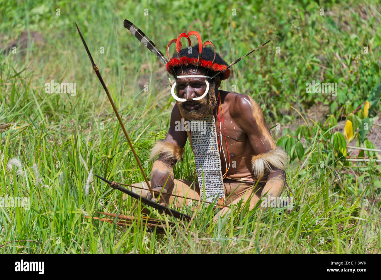 Dani man wearing kotekas (penis gourd) with arrow and bow at Baliem Valley  Festival, Wamena, Papua, Indonesia Stock Photo - Alamy