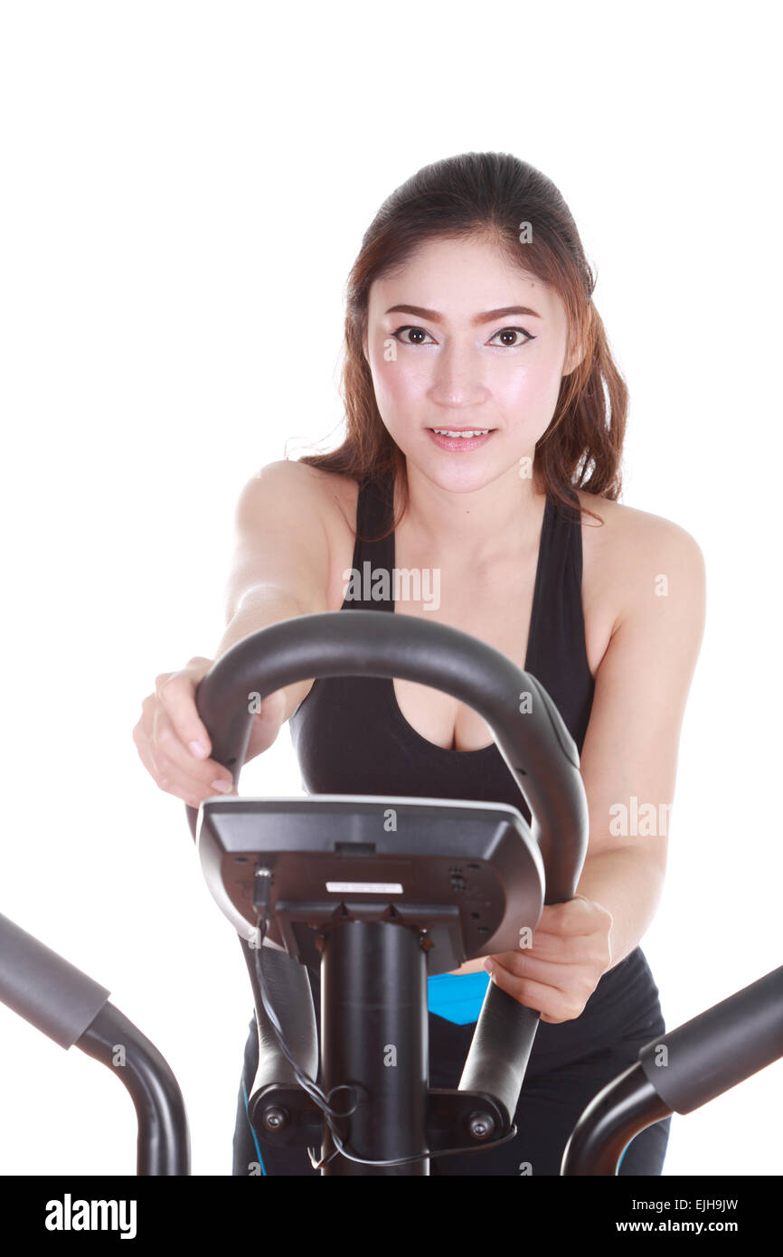young woman doing exercises with exercise machine, on white background Stock Photo Alamy