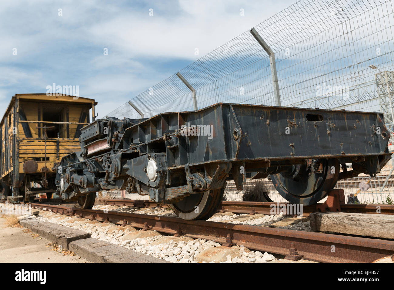 old railway cars stand on the track Stock Photo