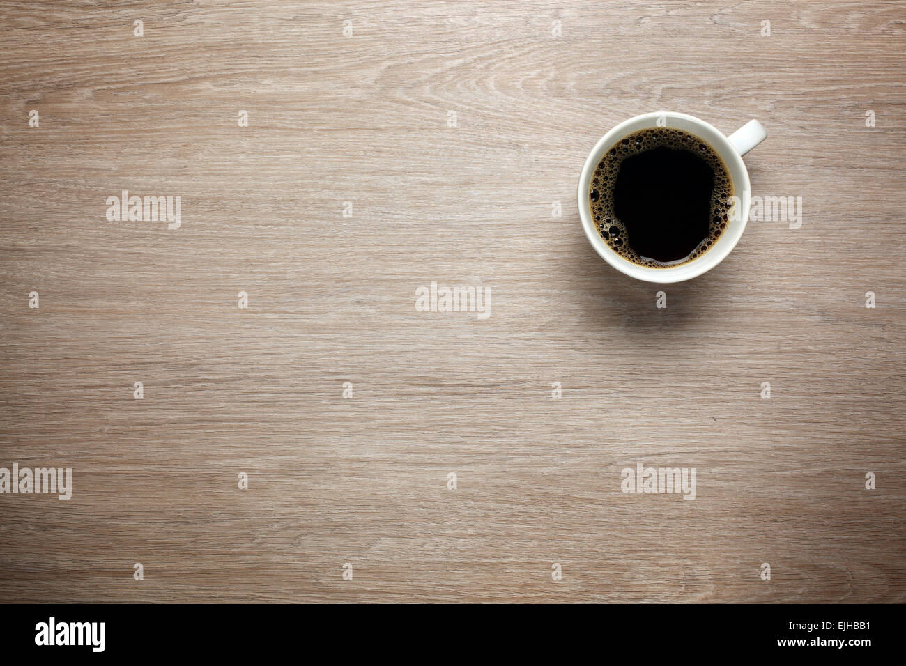 Cup of coffee on desk Stock Photo