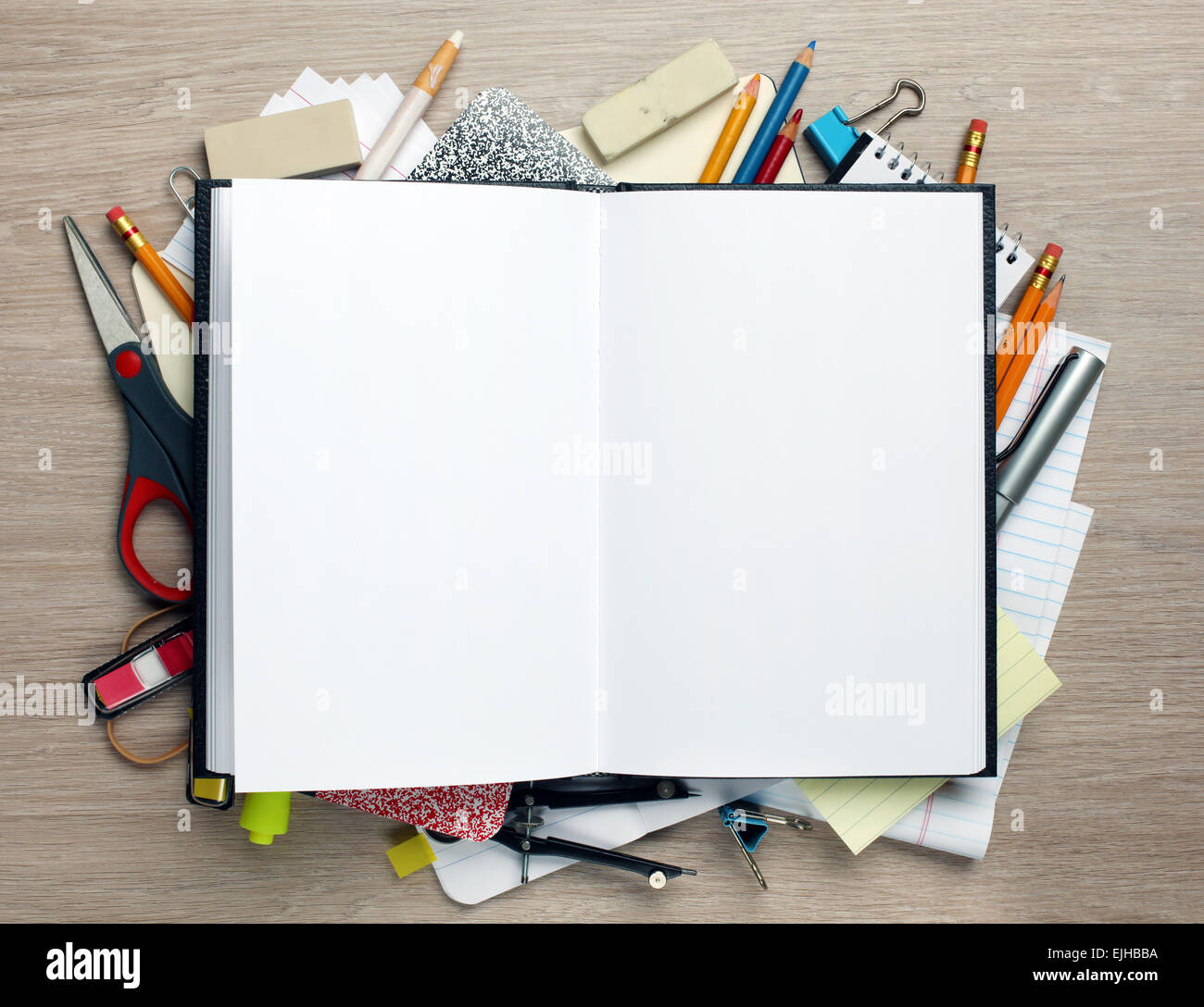 Open book with office supplies Stock Photo