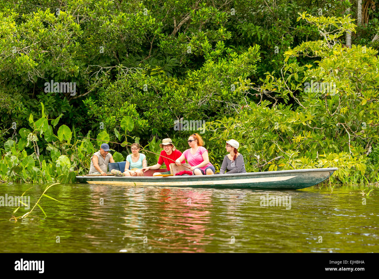 Tourists Fishing Legendary Piranha Fish In Ecuadorian Amazon Primary Jungle Stock Photo