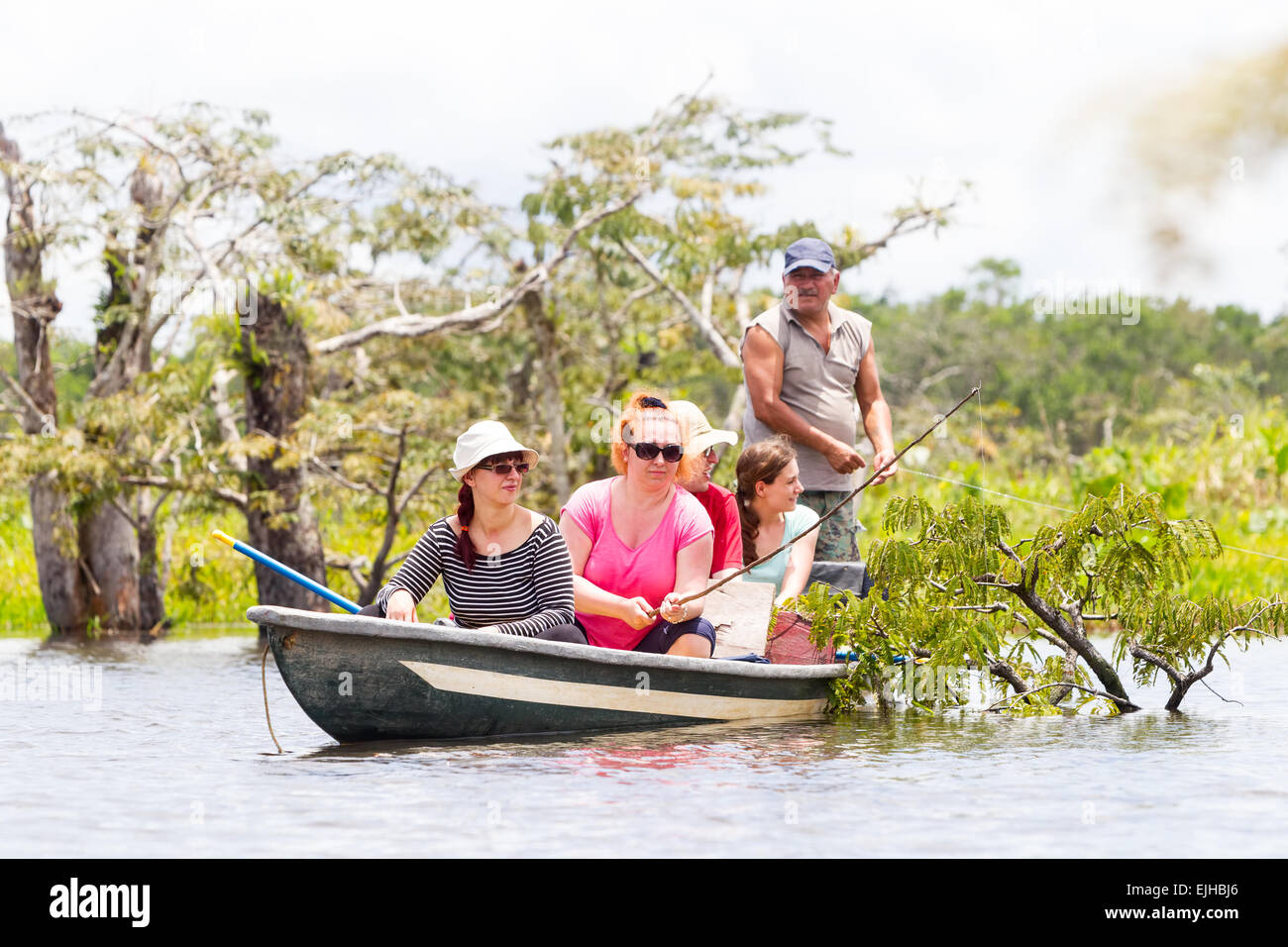 Tourists Fishing Legendary Piranha Fish In Ecuadorian Amazon Primary Jungle Stock Photo