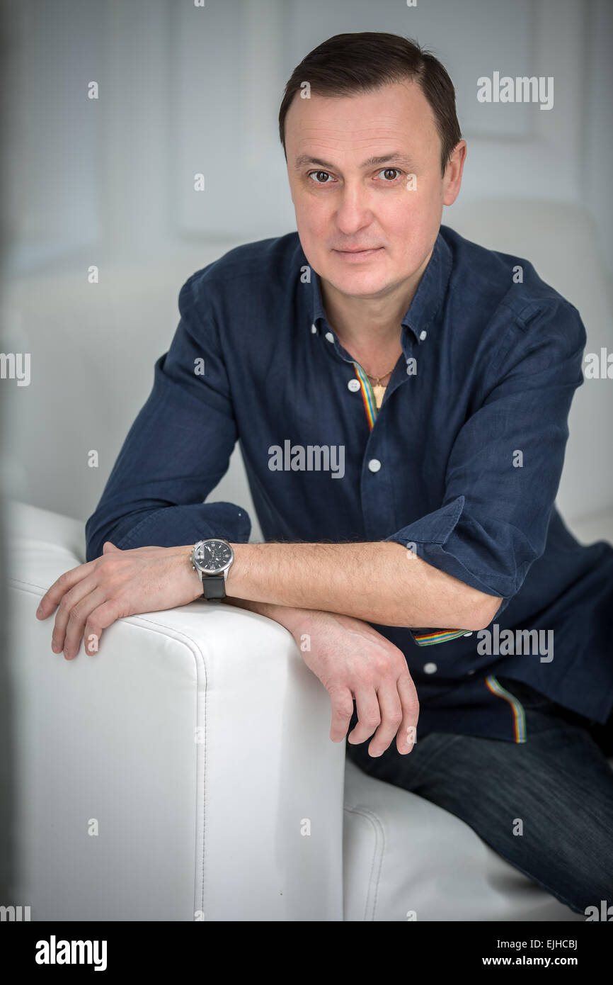 Arab man sitting in sofa hi-res stock photography and images - Alamy