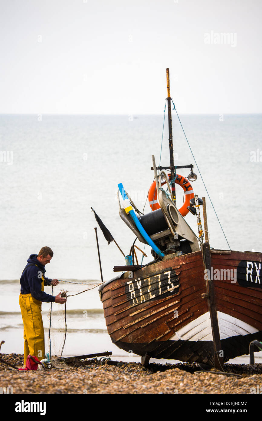 Commercial fishing boats and operations on the beach at Hastings, Sussex, England Stock Photo