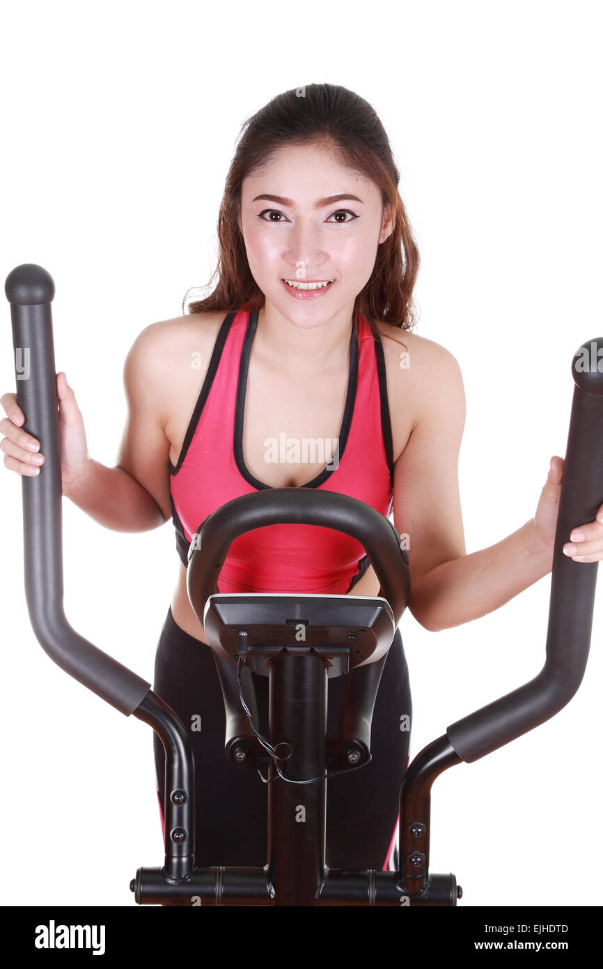 young woman doing exercises with exercise machine, on white background Stock Photo Alamy