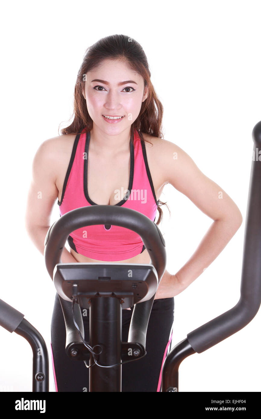 young woman doing exercises with exercise machine, on white background Stock Photo Alamy