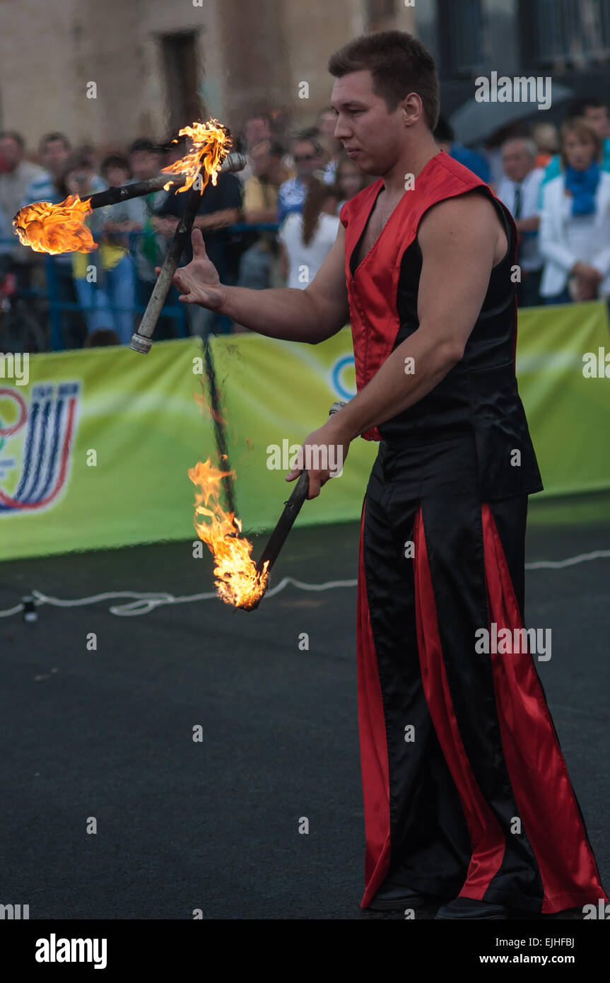 ORENBURG, ORENBURG region, RUSSIA, 25 July, 2014 year. Juggling flaming batons Stock Photo
