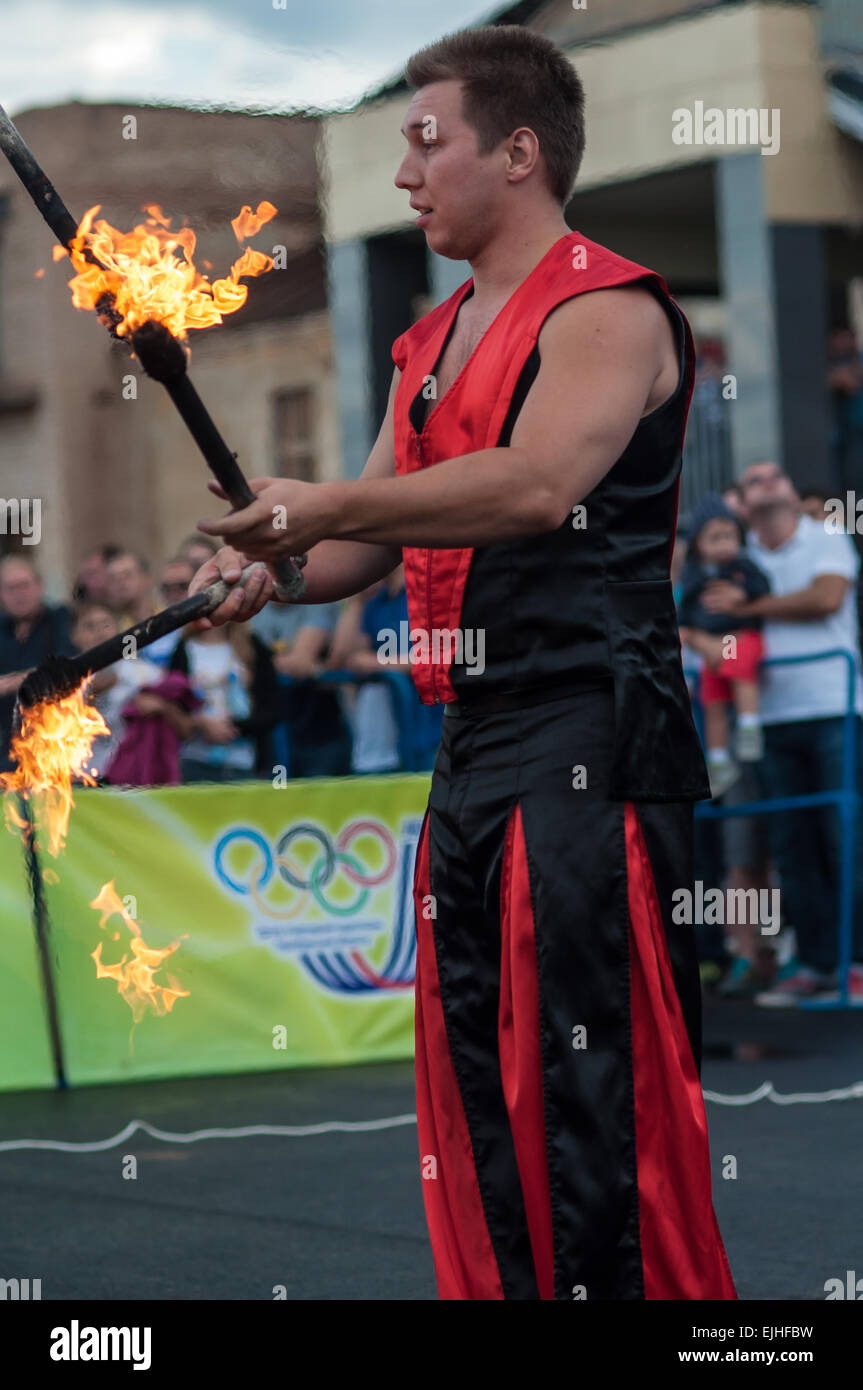 ORENBURG, ORENBURG region, RUSSIA, 25 July, 2014 year. Juggling flaming batons Stock Photo