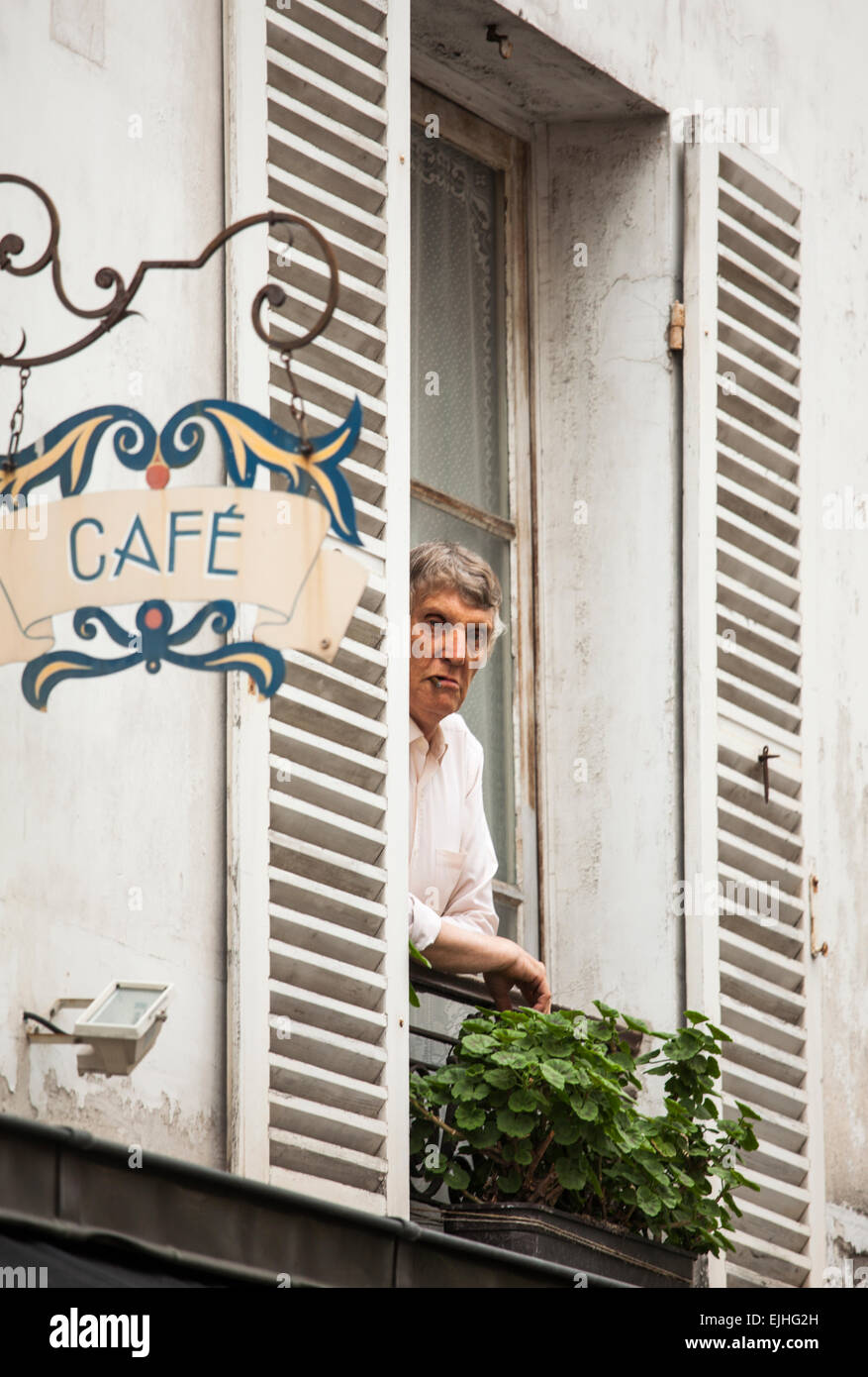 Man smoking out window in Montmartre, Paris, France Stock Photo Alamy