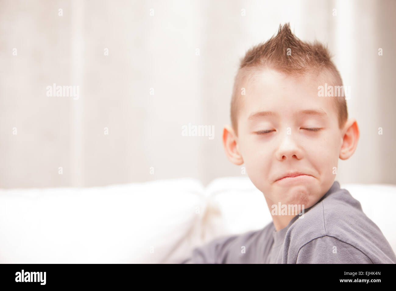 little kid making a funny face pretending to be a serious man very very  disappointed Stock Photo - Alamy