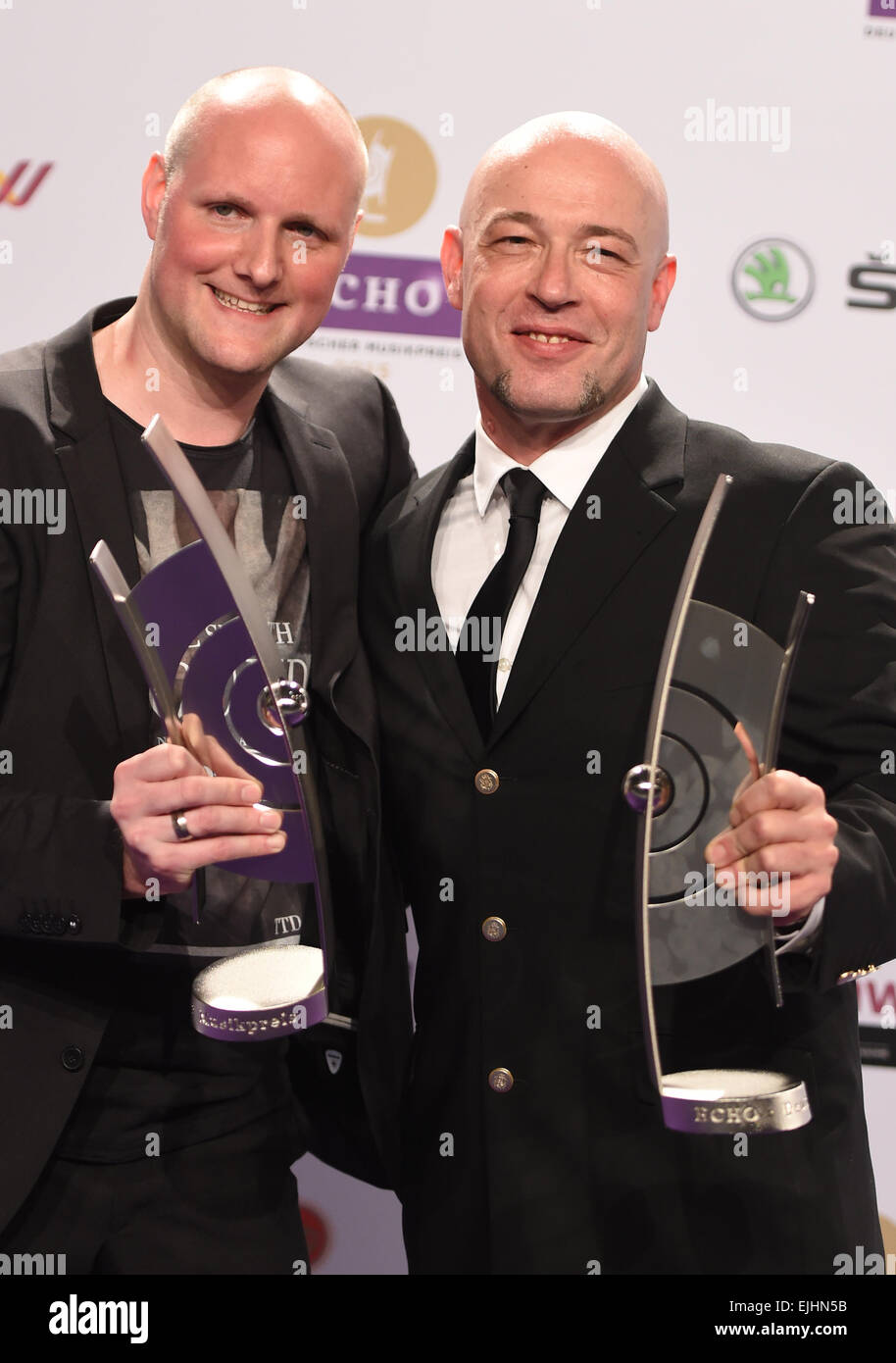 Berlin, Germany. 26th Mar, 2015. The members of the band Unheilig with singer 'der Graf', pose with their award after the Echo Music Awards ceremony in Berlin, Germany, 26 March 2015. Unheilig were awarded in the category 'Rock alternativ national'. The awards were presented for the 24th time. Photo:Jens Kalaene/dpa/Alamy Live News Stock Photo