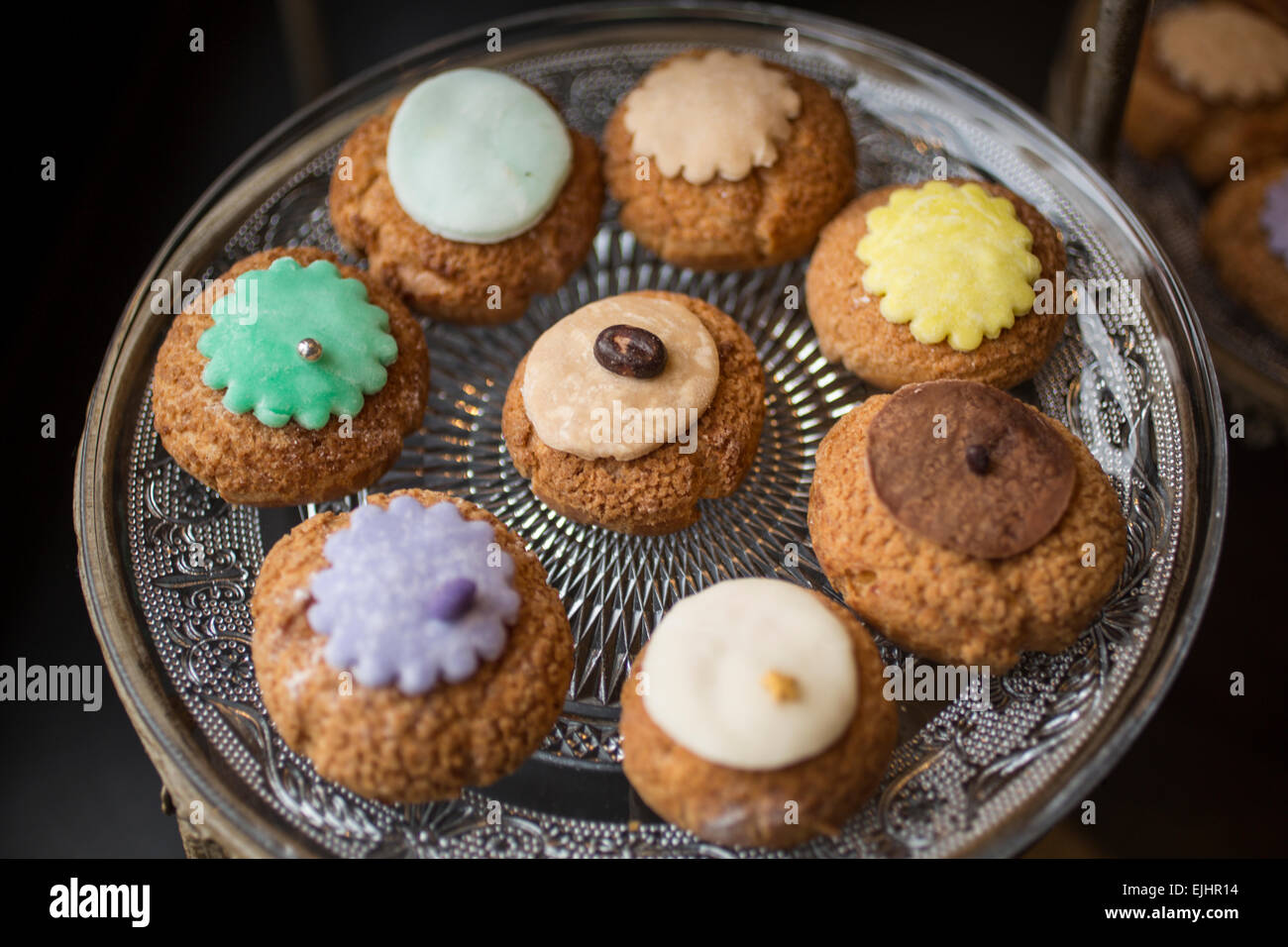 Cream puffs on dishes, Odette pastry shop, Paris, France Stock Photo