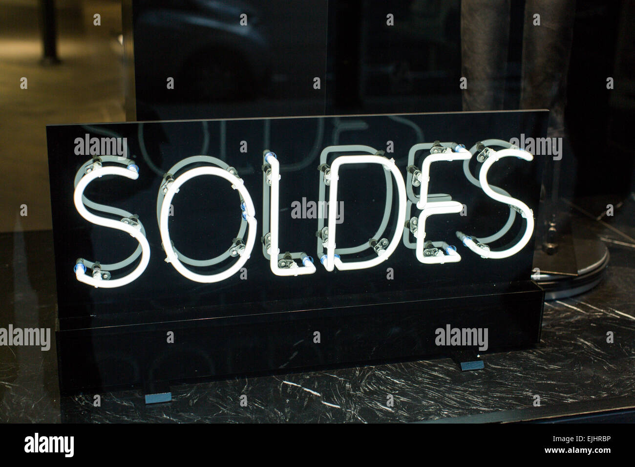 Soldes (sales) sign in shop window, Paris France Stock Photo