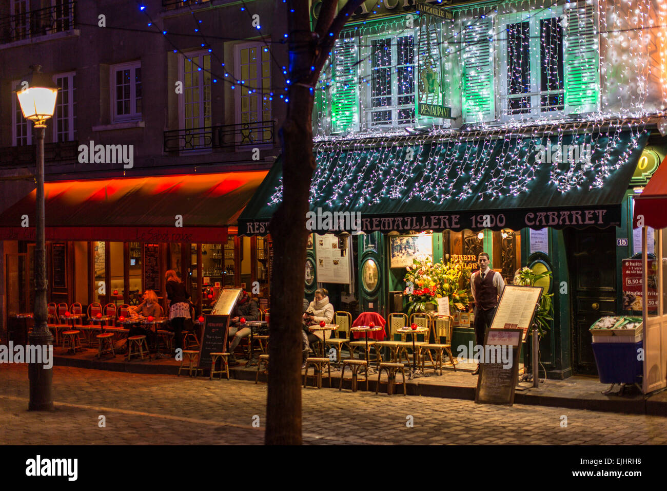 Outdoor cafe restaurant in Montmartre at night, Paris, France Stock Photo