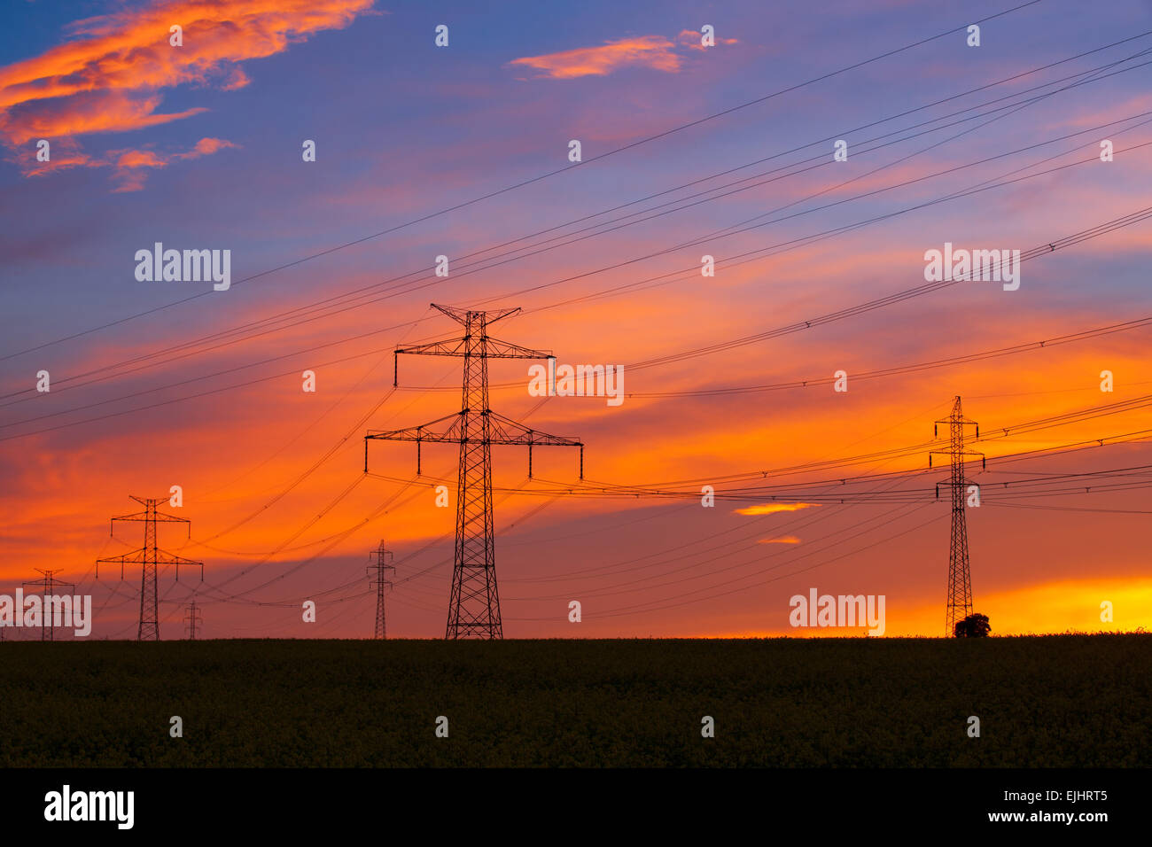 Silhouette of high voltage electrical pole structure at sunset Stock ...