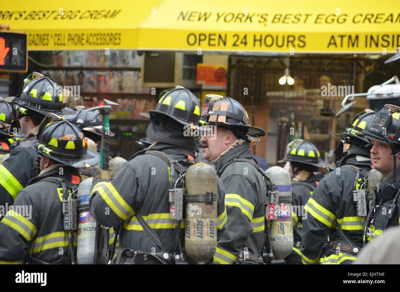 Firefighters respond to an explosion and partial building collapse, in ...