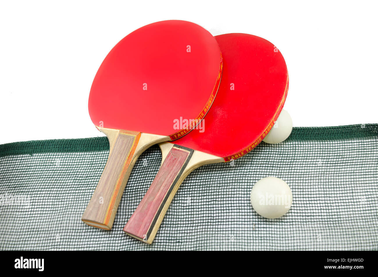 Two red table tennis rackets and a net isolated on white Stock Photo