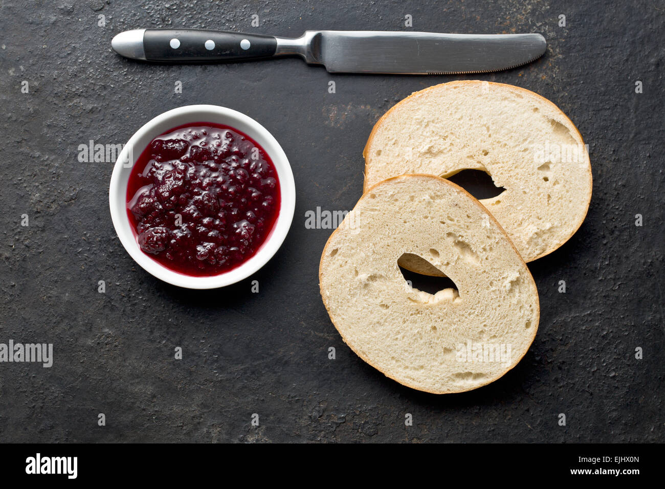 bagel and jam on black background Stock Photo