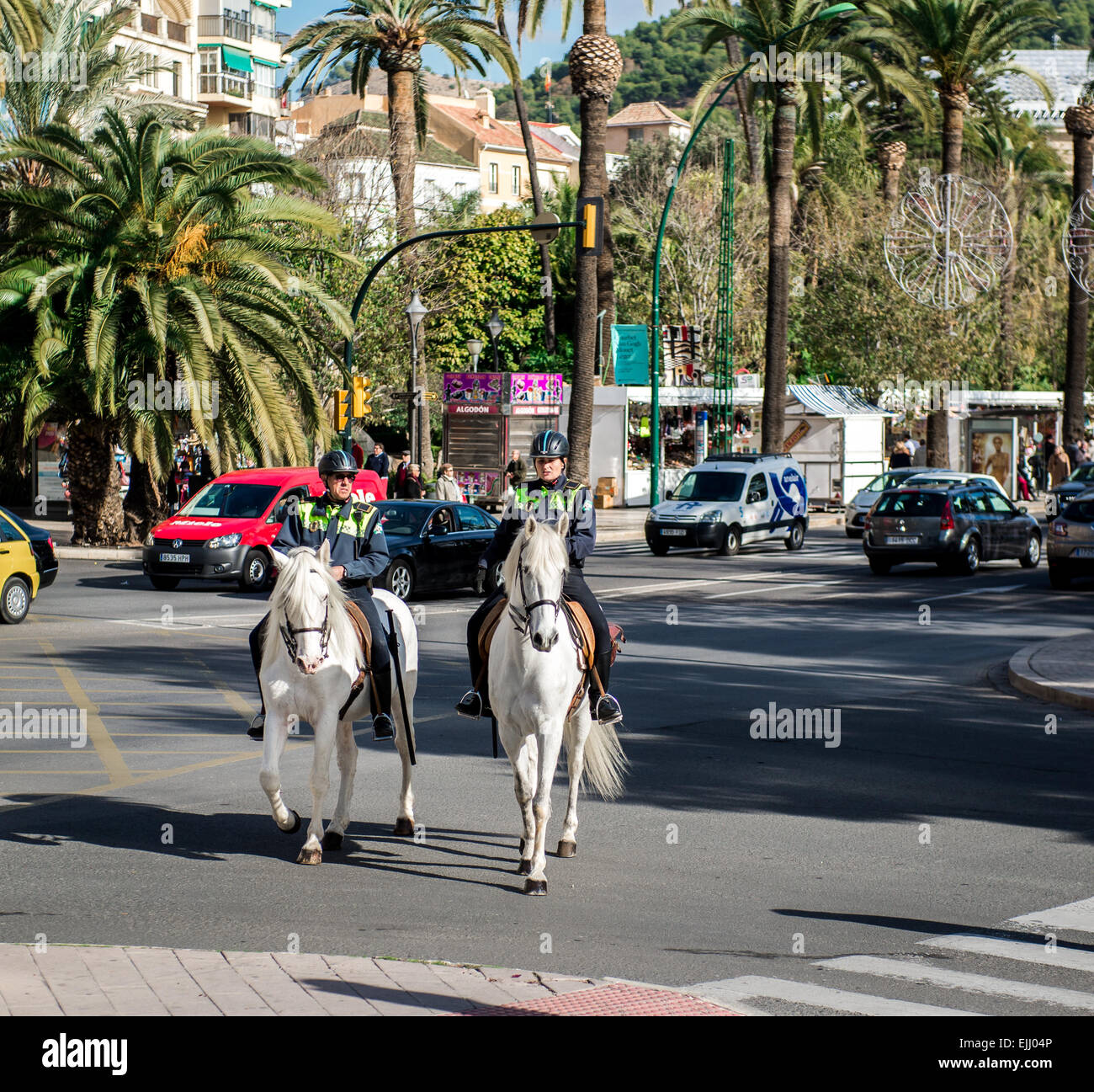 Mounted police patrol at Malaga street Stock Photo