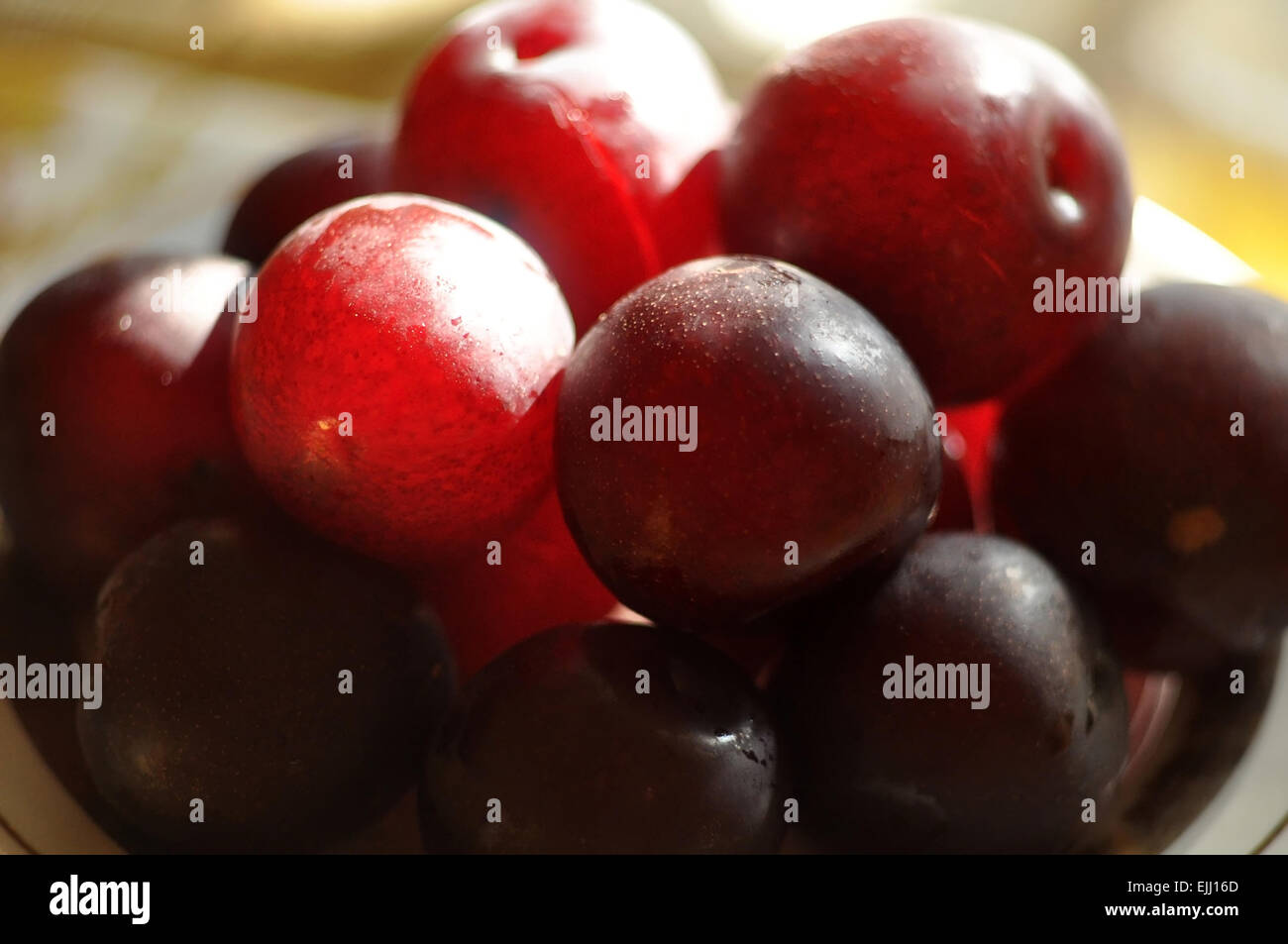 Cherry plum fruit on a plate. Stock Photo