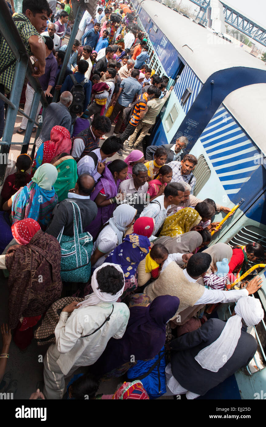 Passengers board a train at Rohtak railway station Stock Photo