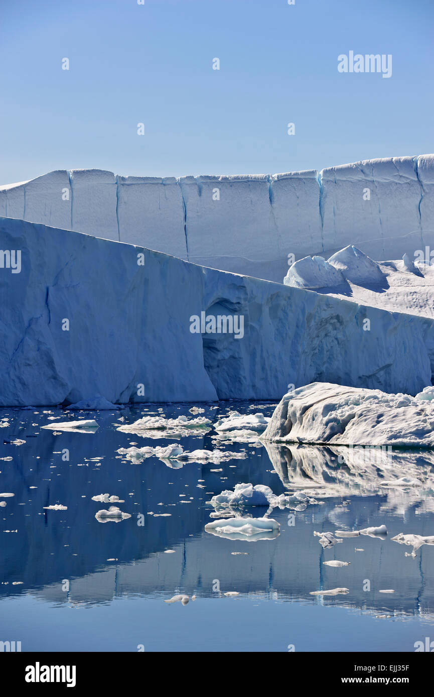 Huge icebergs calved by the Jakobshavn glacier, and may stay in the icefjord for years. Stock Photo